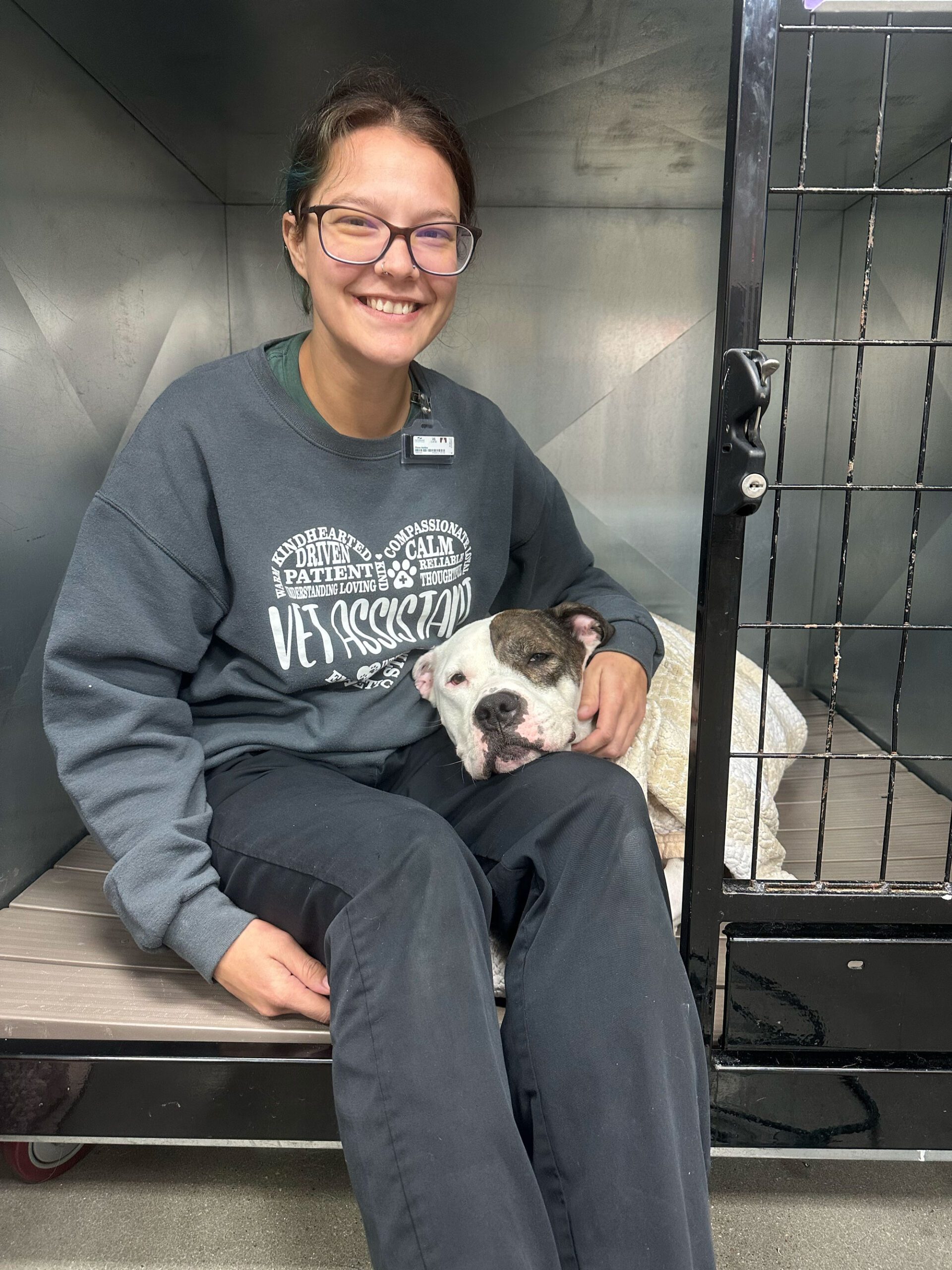 client and tech in kennel